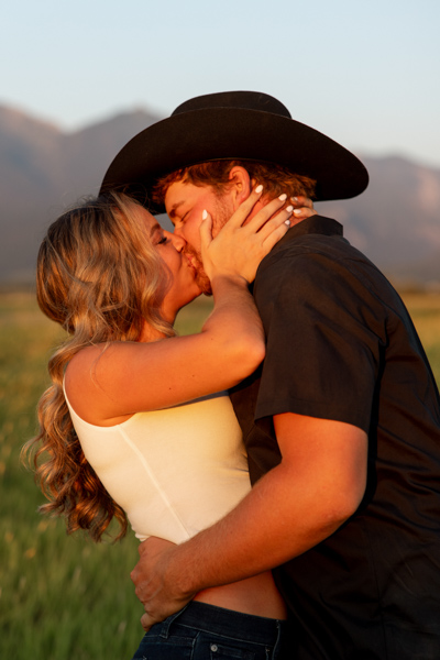 Rilee and Colby sharing a passionate kiss during their Charlo Montana engagement session