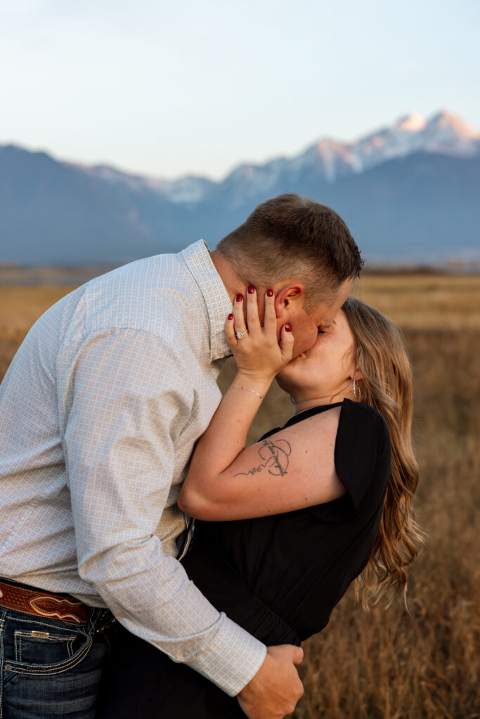 couple kissing during an engagement session in charlo montana