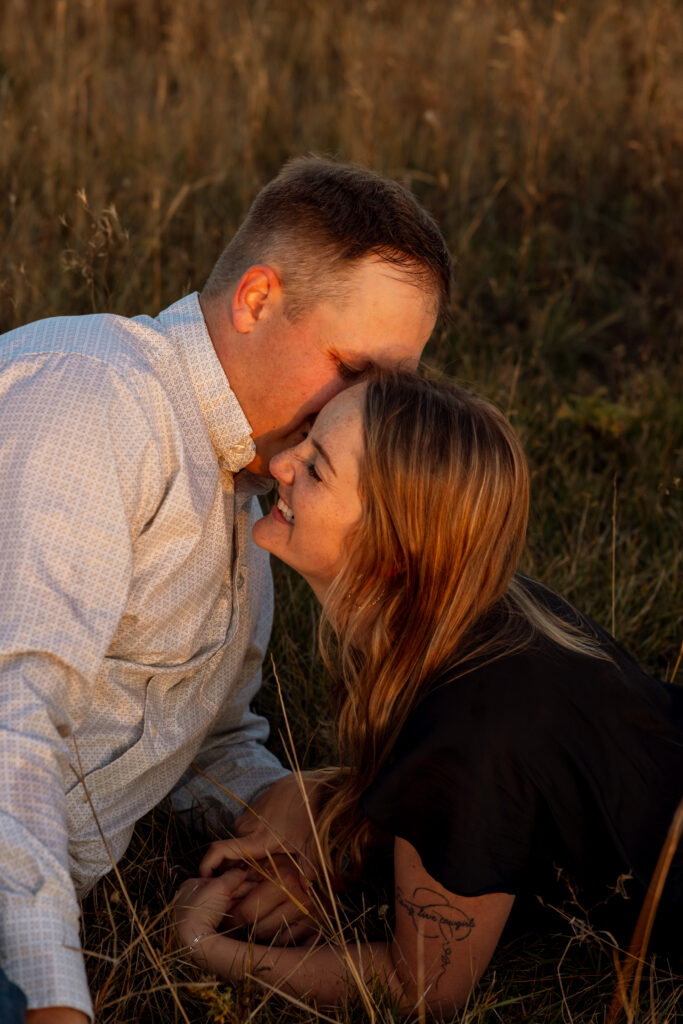 couple laughing during a sunset engagement session in charlo montana