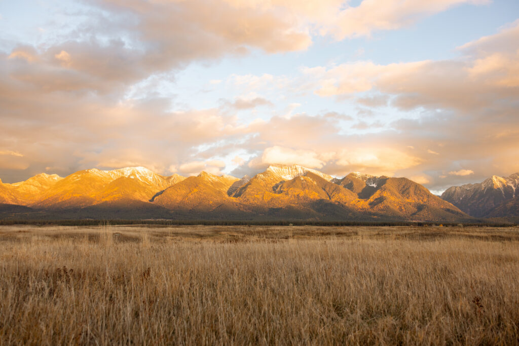 golden glow on the mission mountains at sunset
