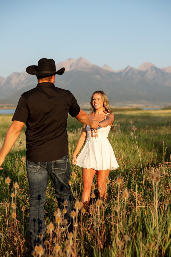 a mission valley engagement session with the mission mountains in the background