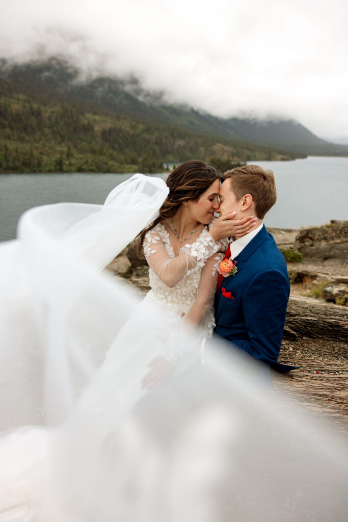 veil photo of bride and groom during glacier national park elopement