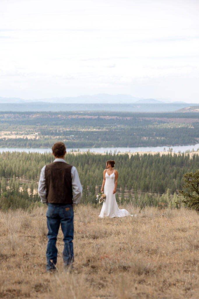 dramatic photo of groom looking at bride standing in the distance