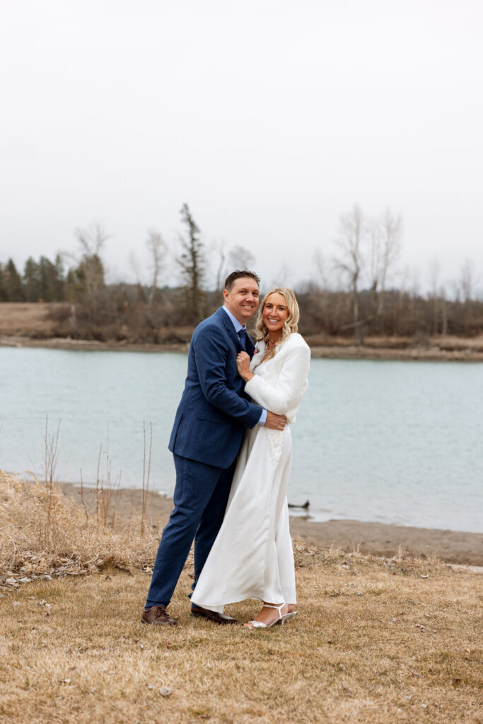 Bride and groom holding each other chest to chest smiling at camera at Diamond B Weddings — Kalispell Montana wedding photographer — Stacy Edwards Photography