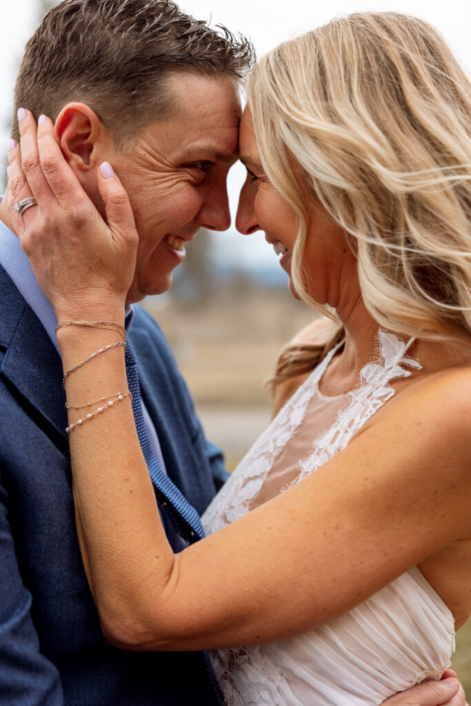 Bride and groom forehead to forehead smiling at each other at Diamond B Weddings — Kalispell Montana wedding photographer — Stacy Edwards Photography