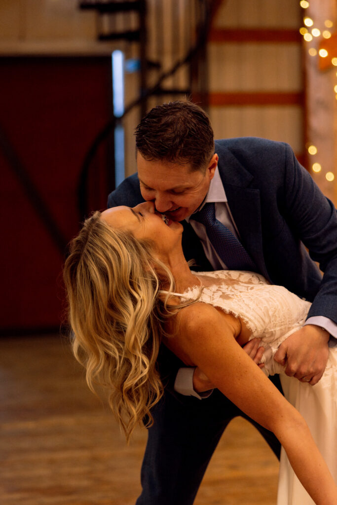 Groom dipping bride almost kissing at Diamond B Weddings — Kalispell Montana wedding photographer — Stacy Edwards Photography