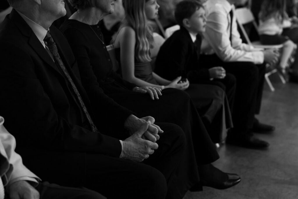 Bride and groom smiling at officiant from alternate angle during ceremony at Diamond B Weddings — Kalispell Montana wedding photographer — Stacy Edwards Photography