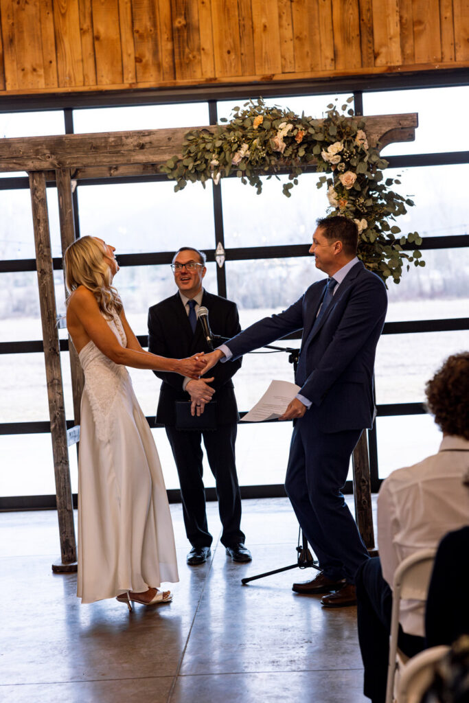 Bride and groom sharing a silly laugh during wedding ceremony at Diamond B Weddings — Kalispell Montana wedding photographer — Stacy Edwards Photography