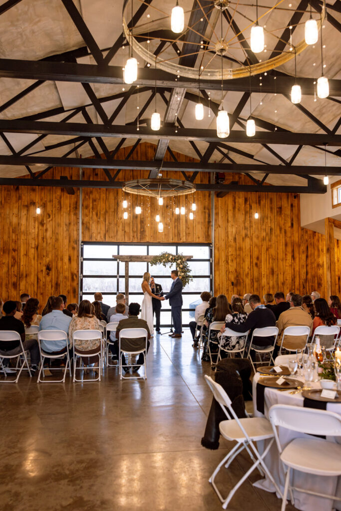 Here are all 11! 🤍
Wide shot of bride and groom holding hands at the altar during ceremony at Diamond B Weddings — Kalispell Montana wedding photographer — Stacy Edwards Photography