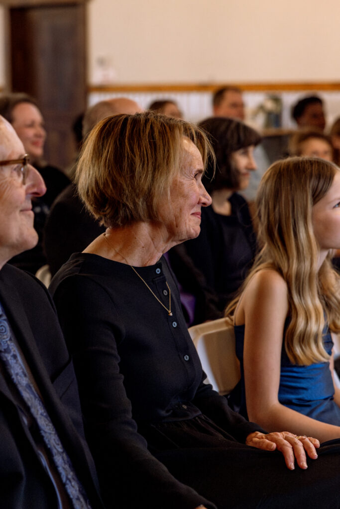 Bride's mom tearing up with a small smile during wedding ceremony at Diamond B Weddings — Kalispell Montana wedding photographer — Stacy Edwards Photography