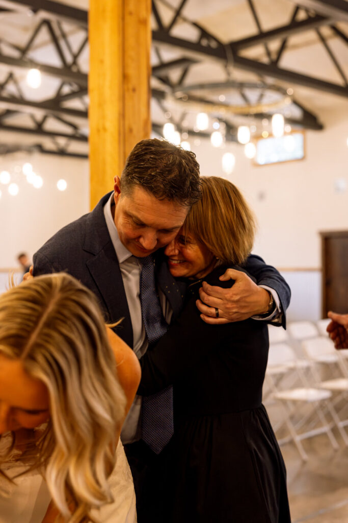 Groom hugging bride's mother during wedding day — Scott and Molly — Diamond B Weddings Kalispell Montana — Stacy Edwards Photography