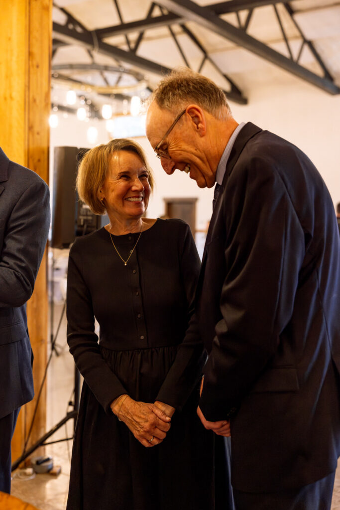 Bride's parents smiling and laughing during marriage license signing — Scott and Molly — Diamond B Weddings Kalispell Montana — Stacy Edwards Photography