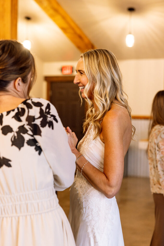 Candid side profile of bride smiling during wedding day — Scott and Molly — Diamond B Weddings Kalispell Montana — Stacy Edwards Photography