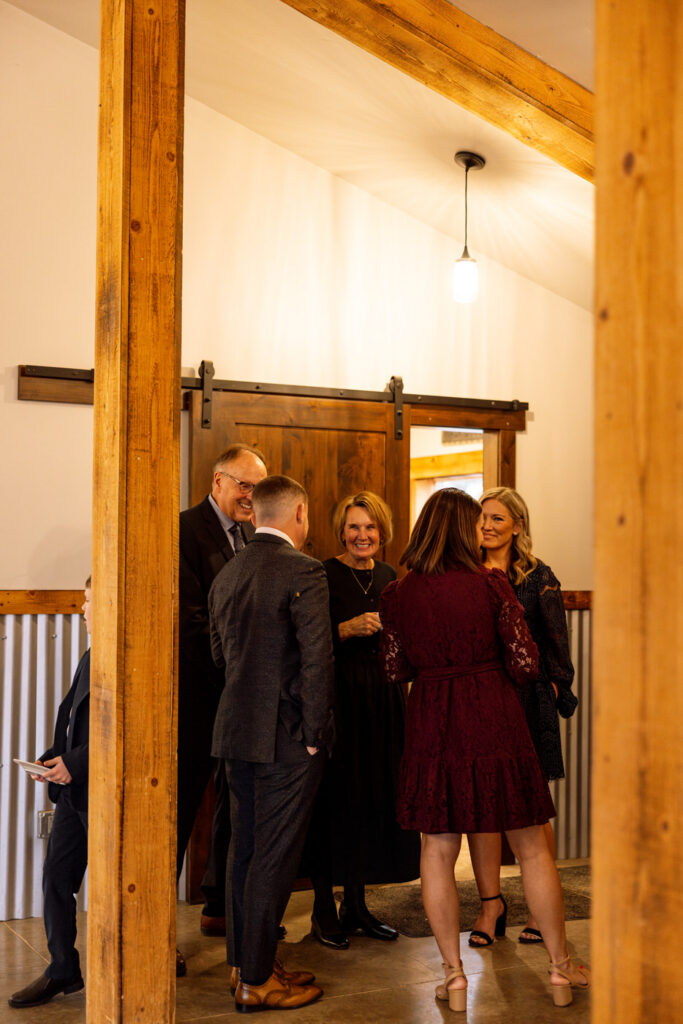 Wedding guests mingling during reception, bride's mother smiling in center — Scott and Molly — Diamond B Weddings Kalispell Montana — Stacy Edwards Photography