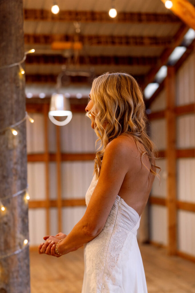 Bride side profile smiling as she walks in for first look at Diamond B Weddings — Kalispell Montana wedding photographer — Stacy Edwards Photography