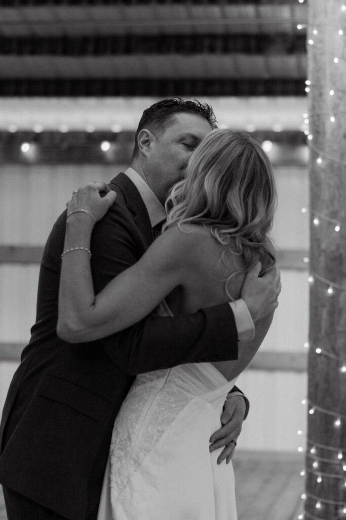 Black and white of bride and groom kissing after first look at Diamond B Weddings — Kalispell Montana wedding photographer — Stacy Edwards Photography