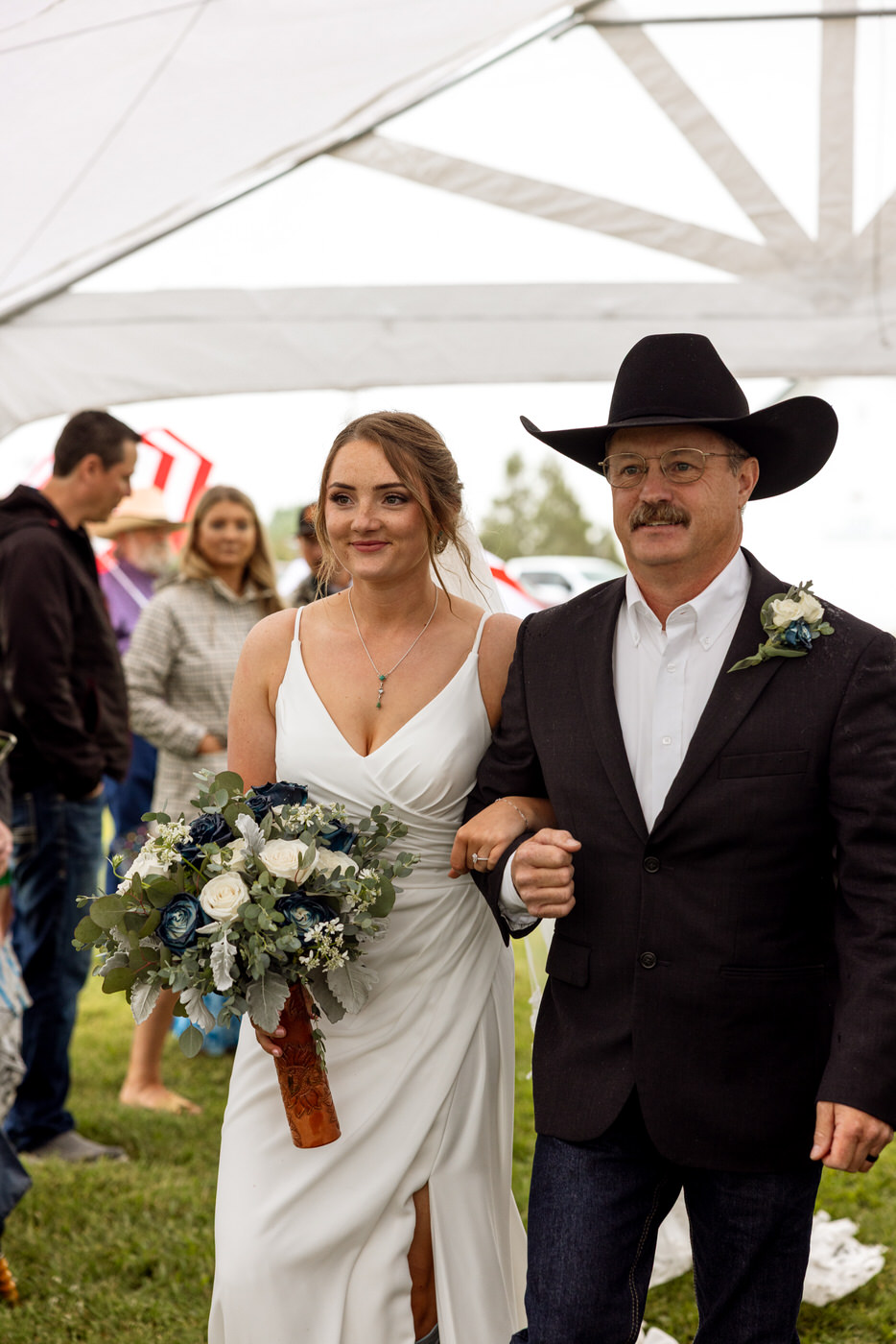 father of the bride walking the bride down the aisle at the ceremony — Aislynn + Kyle — Mission Valley Wedding — Charlo Montana — Stacy Edwards Photography
