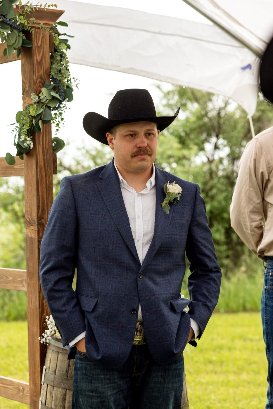 Groom waiting at the alter during the ceremony with tears falling down his cheeks — Aislynn + Kyle — Mission Valley Wedding — Charlo Montana — Stacy Edwards Photography