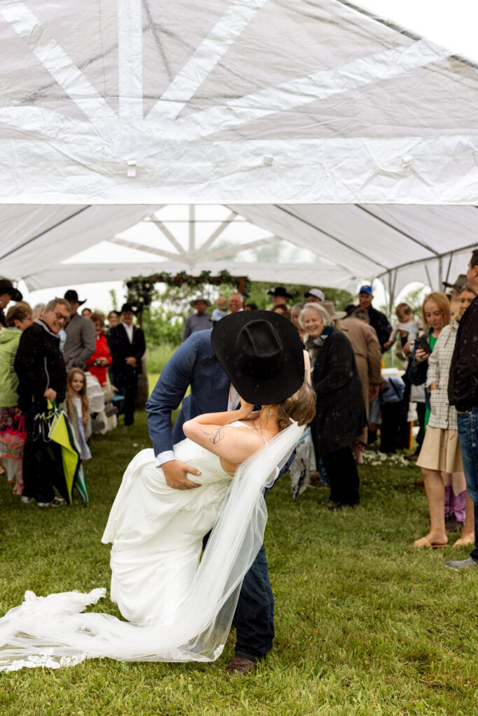Groom dipping and kissing bride at the ceremony — Aislynn + Kyle — Mission Valley Wedding — Charlo Montana — Stacy Edwards Photography