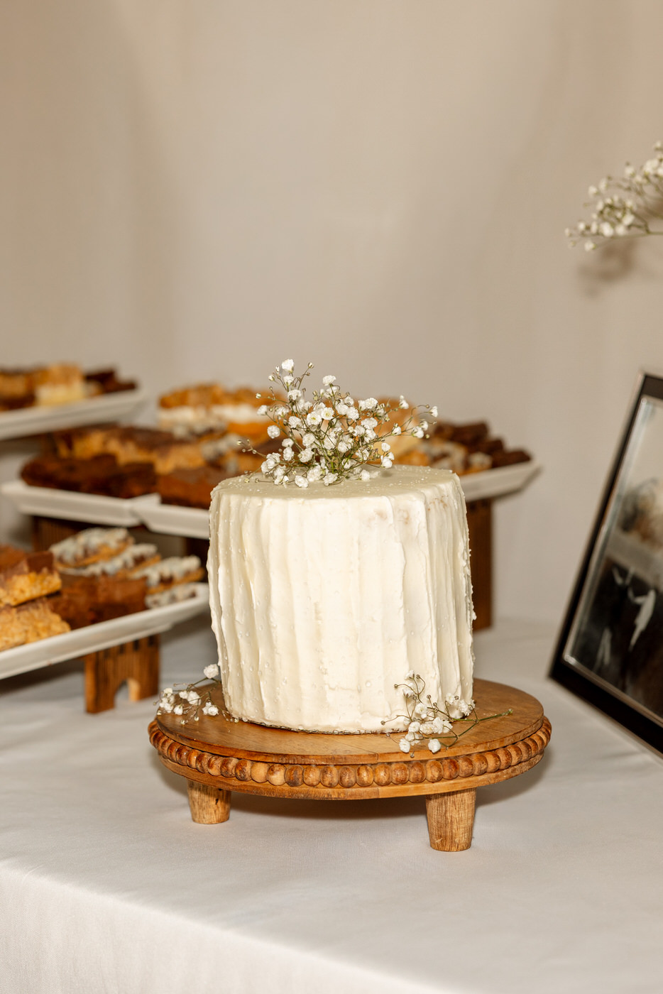 Detail photo of simple white wedding cake — Aislynn + Kyle — Mission Valley Wedding — Charlo Montana — Stacy Edwards Photography