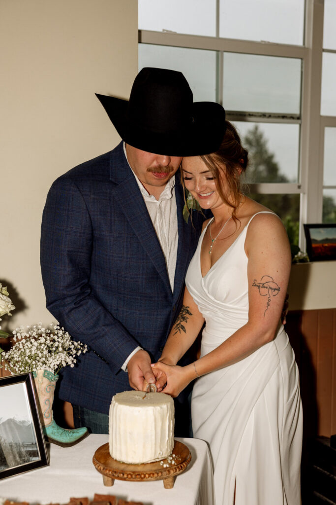 Bride and groom cutting the wedding cake — Aislynn + Kyle — Mission Valley Wedding — Charlo Montana — Stacy Edwards Photography