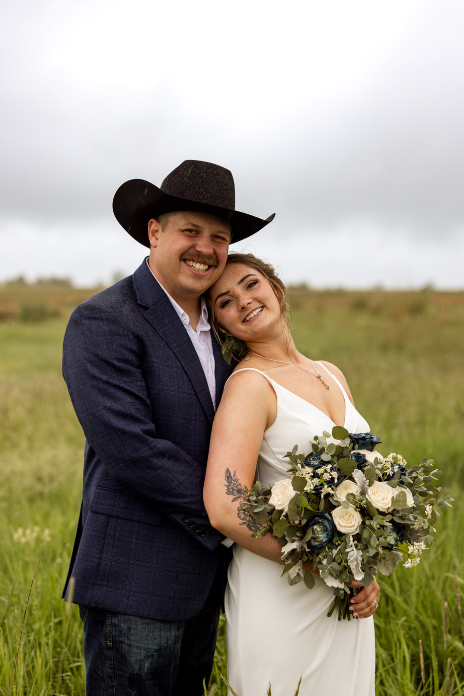 Bride and groom standing together and smiling at the camera — Aislynn + Kyle — Mission Valley Wedding — Charlo Montana — Stacy Edwards Photography