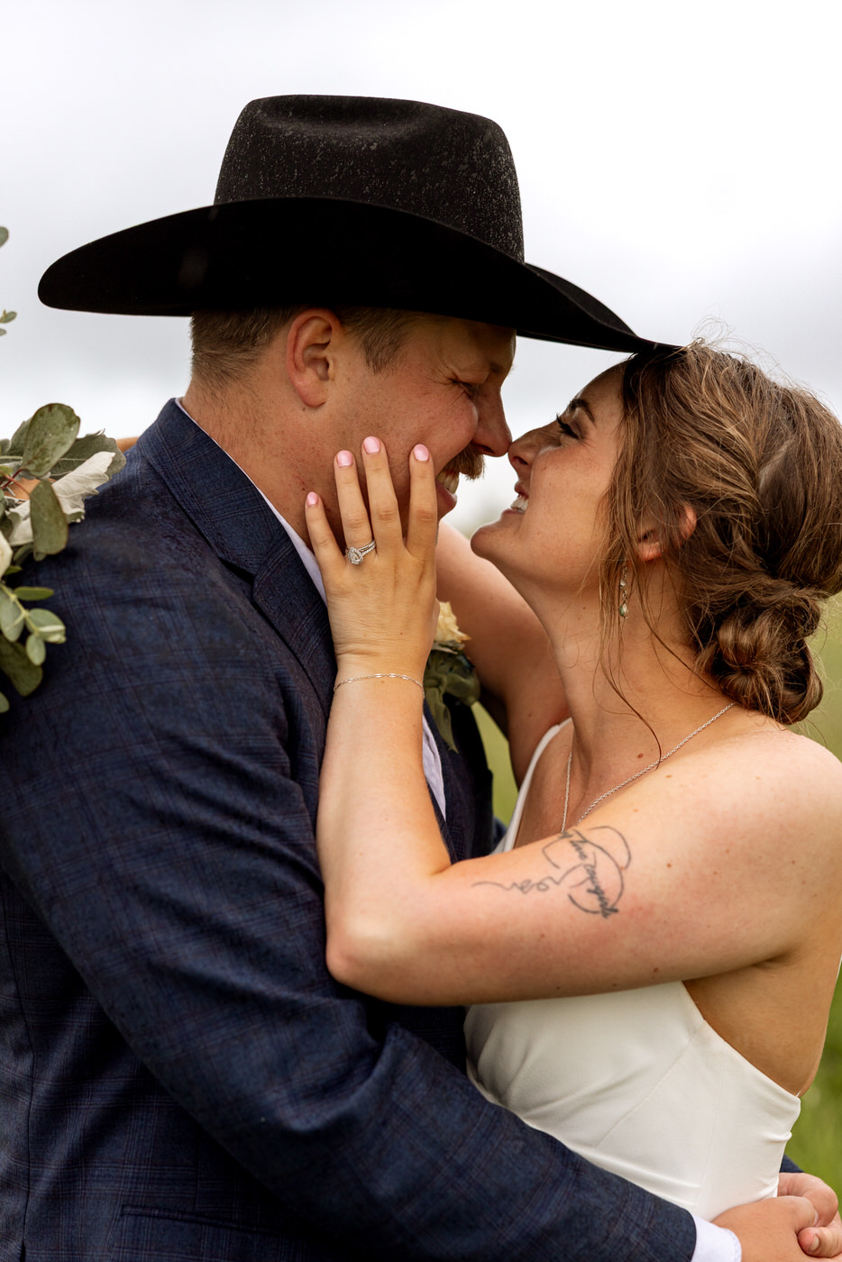 Close up of bride and groom smiling at each other, noses touching — Aislynn + Kyle — Mission Valley Wedding — Charlo Montana — Stacy Edwards Photography