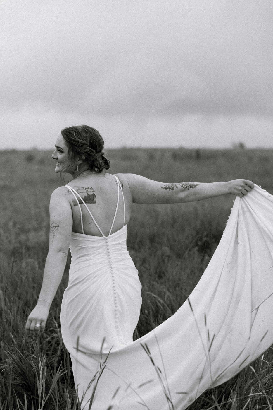 Black and white of bride twirling in wedding dress — Aislynn + Kyle — Mission Valley Wedding — Charlo Montana — Stacy Edwards Photography