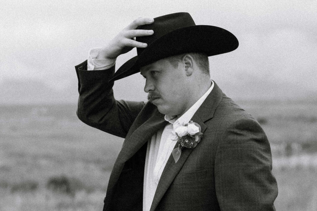 Black and White Photo of Groom in Cowboy Hat — Aislynn + Kyle — Mission Valley Wedding — Charlo Montana — Stacy Edwards Photography