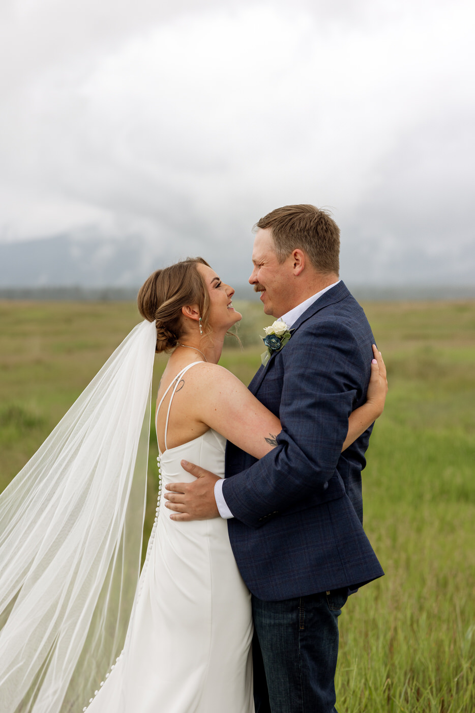 Close up pboto of bride and groom smiling at each other — Aislynn + Kyle — Mission Valley Wedding — Charlo Montana — Stacy Edwards Photography