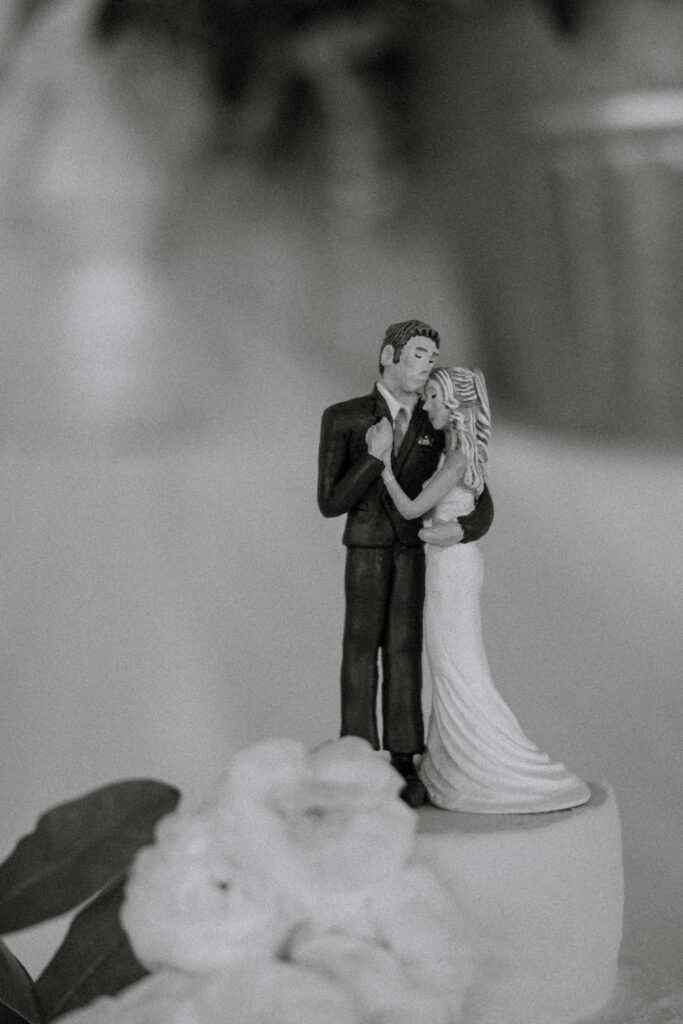 Handmade clay cake topper of bride and groom made by the bride's sister — Micah and Greg's wedding at Ember and Altar — Montana wedding photographer Stacy Edwards Photography