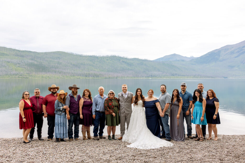 Family portrait on the pebble beach at Jackson Bay ten mile pullout on Lake McDonald — Glacier National Park elopement — Stacy Edwards Photography
