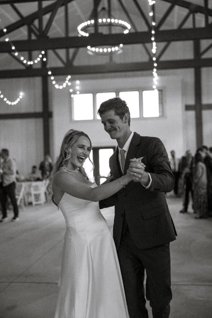 Bride and groom first dance laughing together at Ember and Altar wedding reception — wedding day coverage — Montana wedding photographer Stacy Edwards Photography