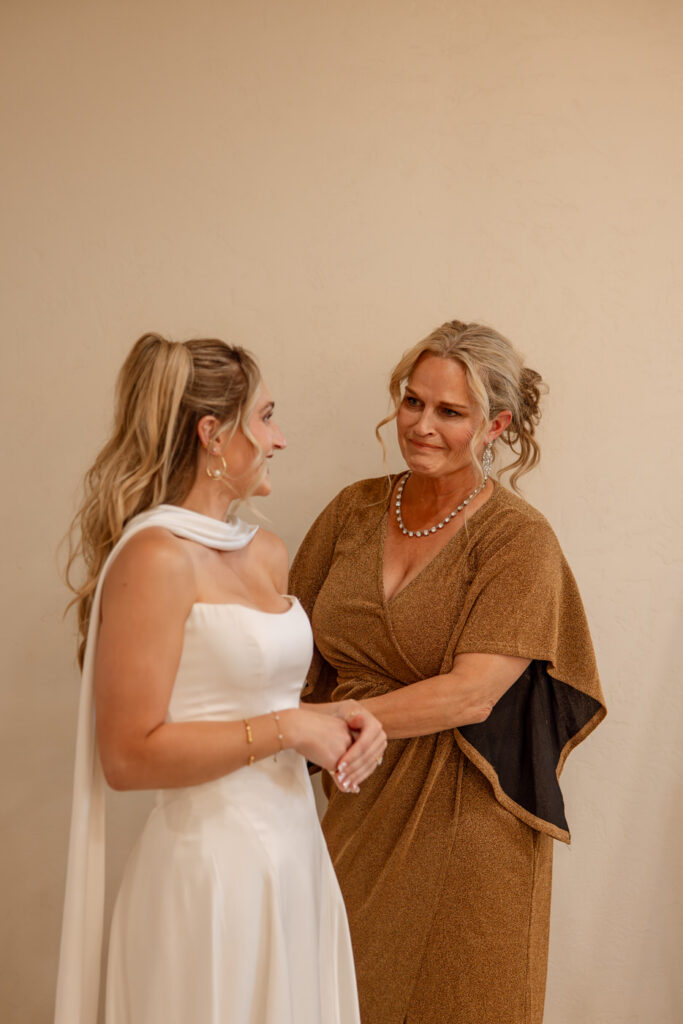 Emotional mother of the bride holding hands with bride before wedding ceremony — wedding day coverage — Montana wedding photographer Stacy Edwards Photography