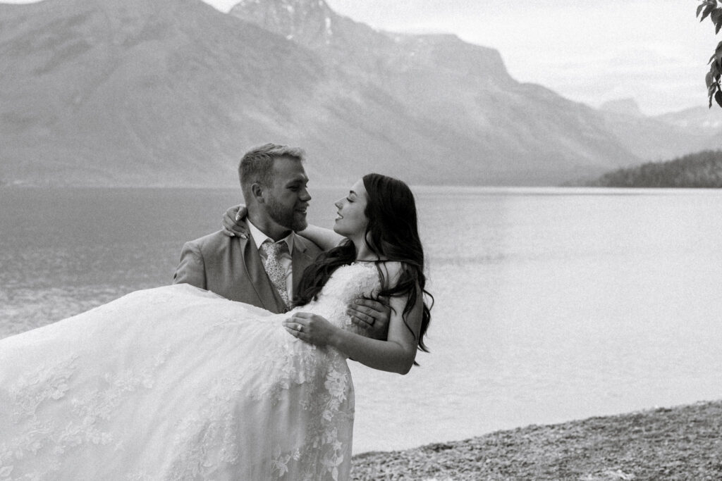 black and white of bride and groom at jackson bay (10-mile pullout) ceremony site in Glacier National Park | Stacy Edwards Photography